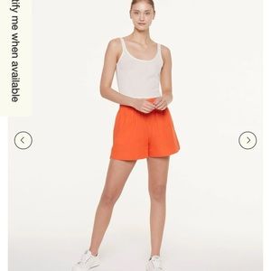 Orange pull on shorts with pockets